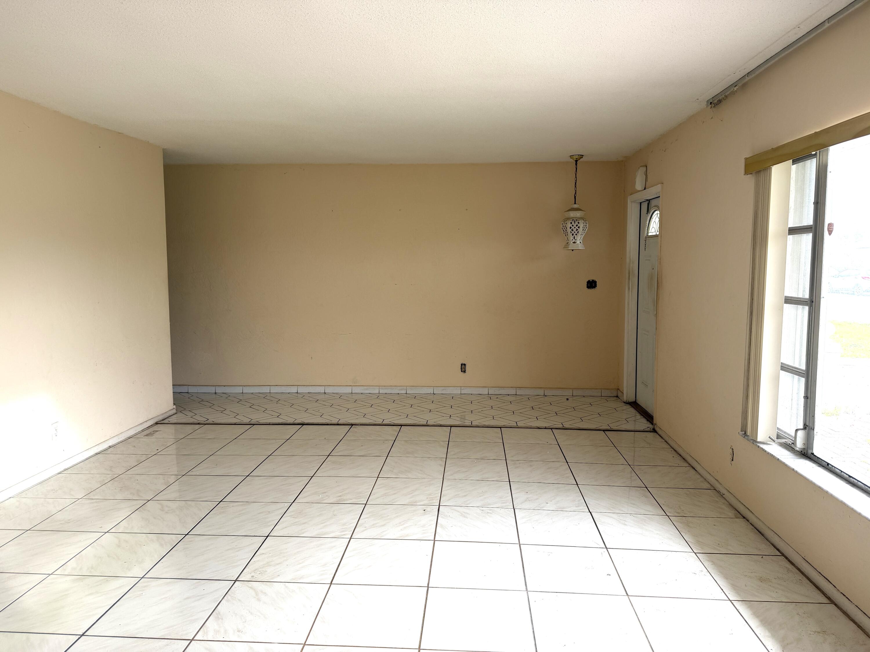 9210 Northwest 73rd Street Tamarac, FL 33321 - Photo 2 of 8 a view of room and window