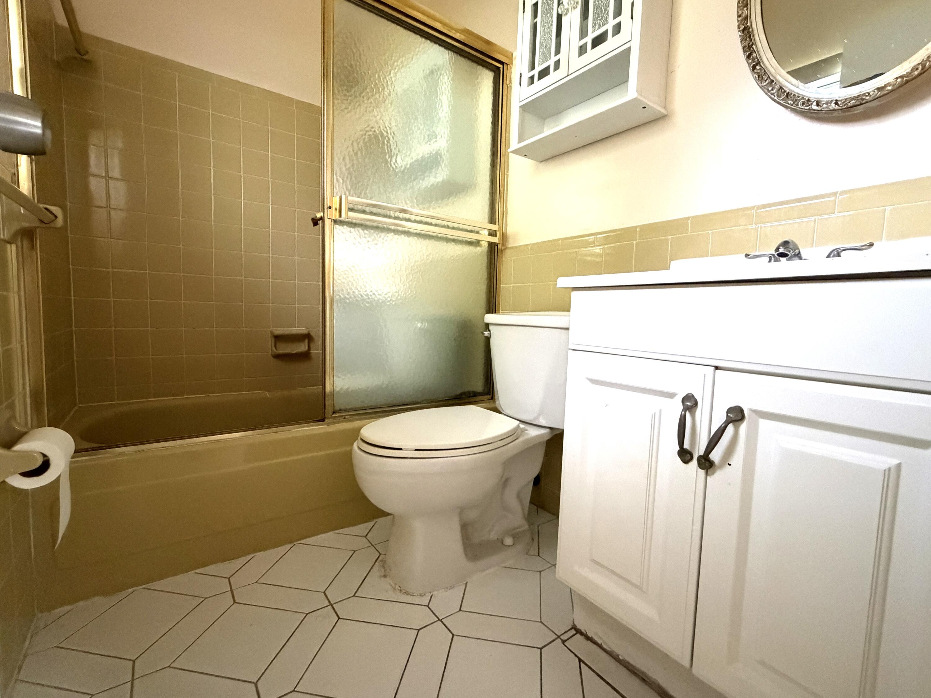 9210 Northwest 73rd Street Tamarac, FL 33321 - Photo 8 of 8 a bathroom with a toilet and a shower