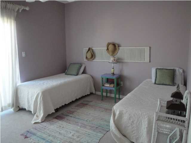 191 Blue Mountain Beach Road, Unit 303 Santa Rosa Beach, FL 32459 - Photo 11 of 20 a bedroom with a bed and a window