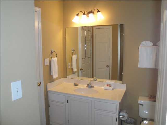 191 Blue Mountain Beach Road, Unit 303 Santa Rosa Beach, FL 32459 - Photo 13 of 20 a bathroom with a double vanity sink and a mirror