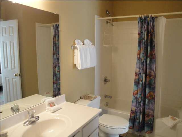 191 Blue Mountain Beach Road, Unit 303 Santa Rosa Beach, FL 32459 - Photo 14 of 20 a bathroom with a sink toilet and shower