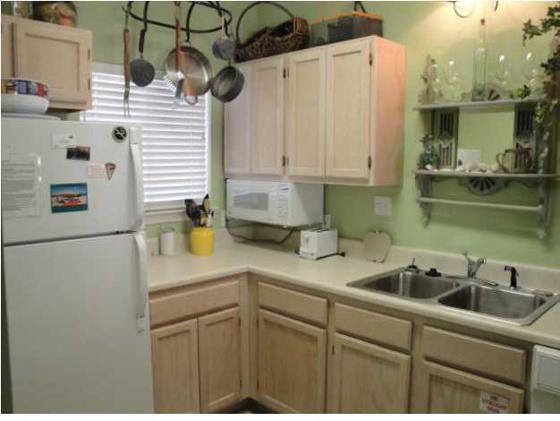 191 Blue Mountain Beach Road, Unit 303 Santa Rosa Beach, FL 32459 - Photo 6 of 20 a kitchen with a sink cabinets and appliances