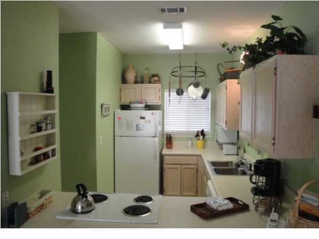 191 Blue Mountain Beach Road, Unit 303 Santa Rosa Beach, FL 32459 - Photo 7 of 20 a kitchen with a sink appliances and cabinets