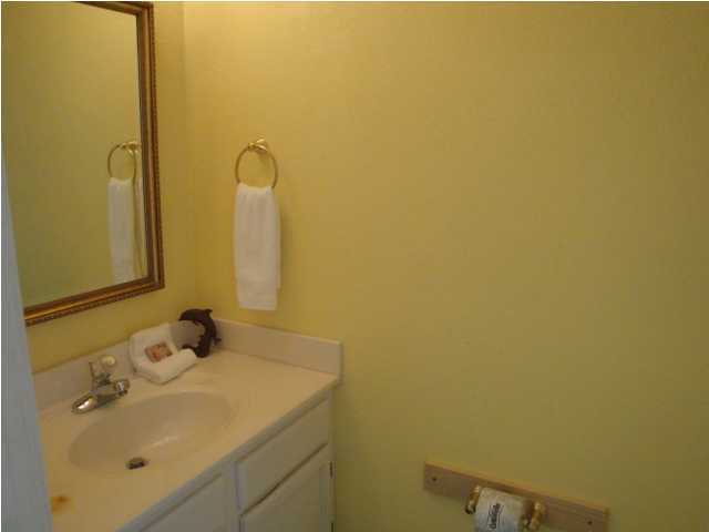 191 Blue Mountain Beach Road, Unit 303 Santa Rosa Beach, FL 32459 - Photo 8 of 20 a bathroom with a sink and mirror