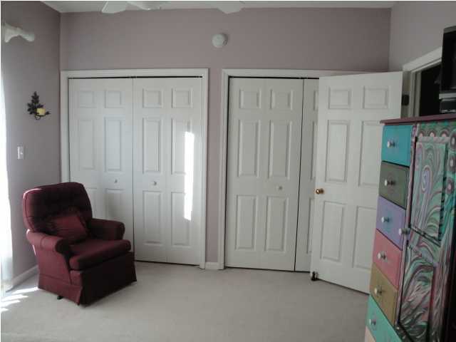191 Blue Mountain Beach Road, Unit 303 Santa Rosa Beach, FL 32459 - Photo 10 of 20 a living room with furniture and a flat screen tv