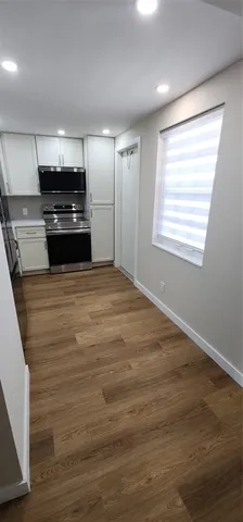 a kitchen with a stove and a refrigerator
