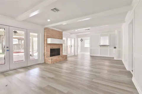 a view of a livingroom with wooden floor