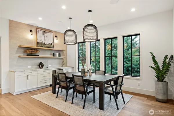 a view of a dining room with furniture window and outside view
