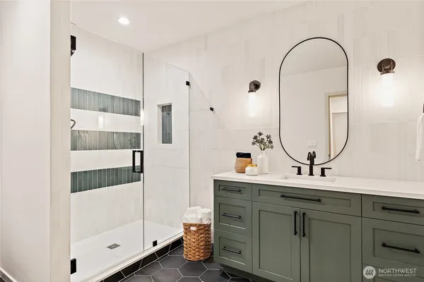 a view of storage and utility room with two washing machine