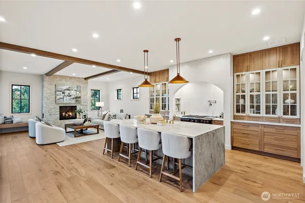 a large kitchen with lots of counter space and stainless steel appliances