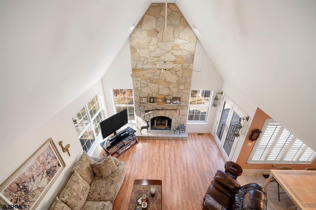 301-315 South Pitney Road Galloway Township, NJ 08205 - Photo 21 of 24 wooden floor in living room with furniture and a fireplace
