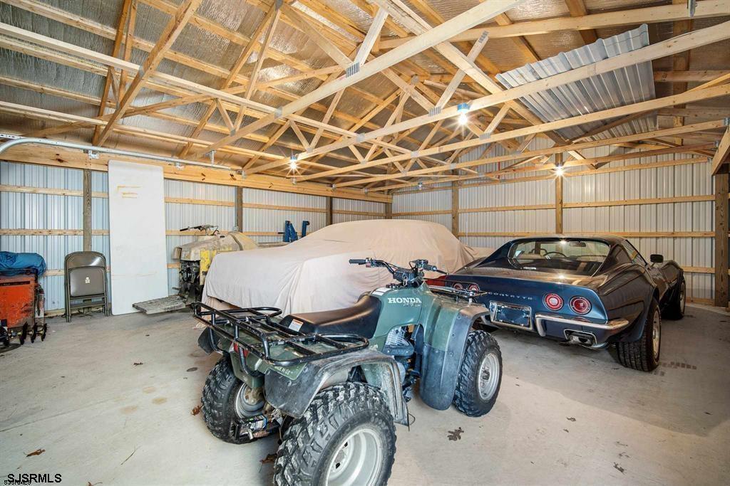 301-315 South Pitney Road Galloway Township, NJ 08205 - Photo 10 of 24 a car and bike parked in a garage