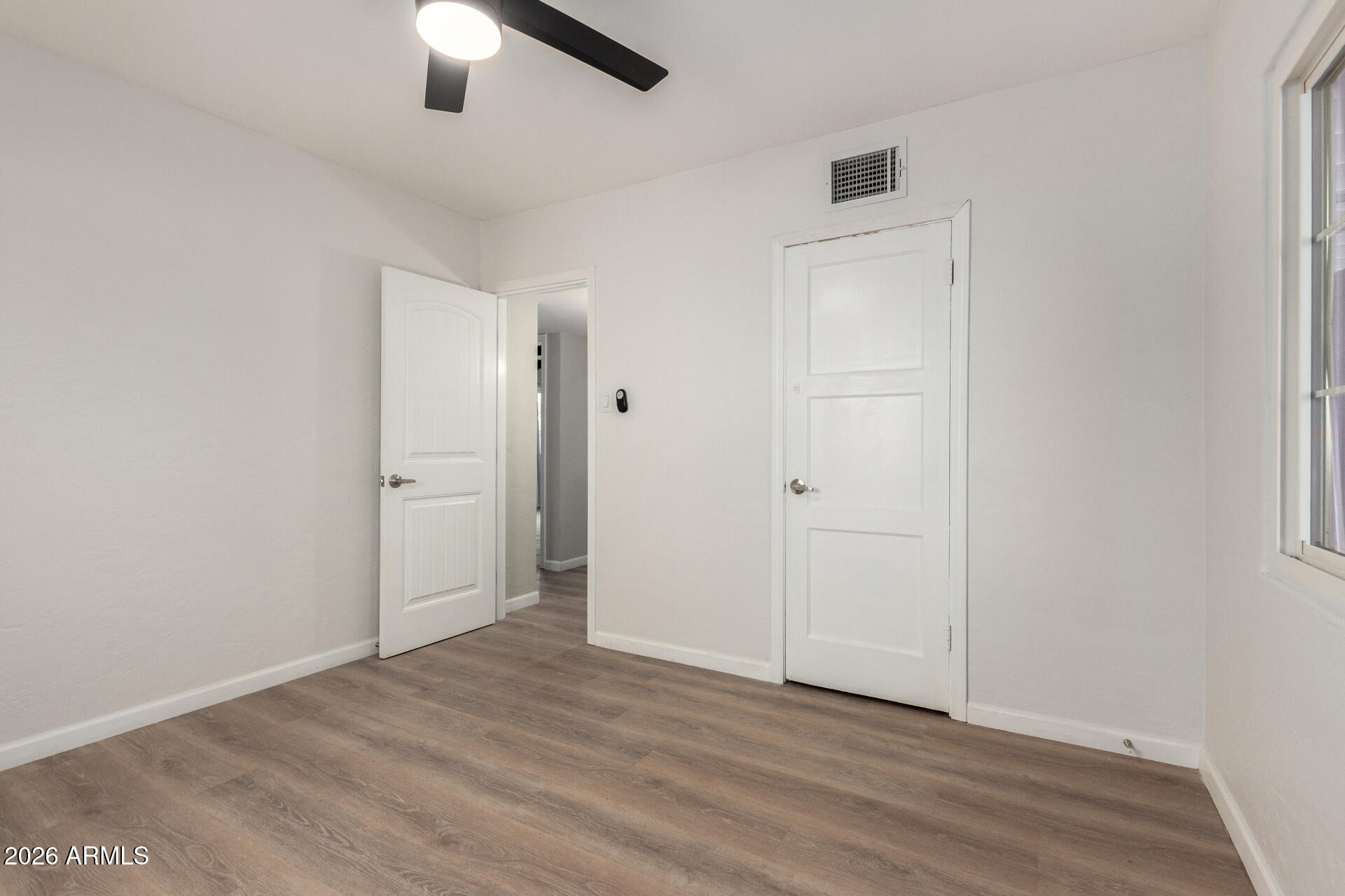 4010 North 11th Avenue Phoenix, AZ 85013 - Photo 14 of 22 wooden floor in an empty room