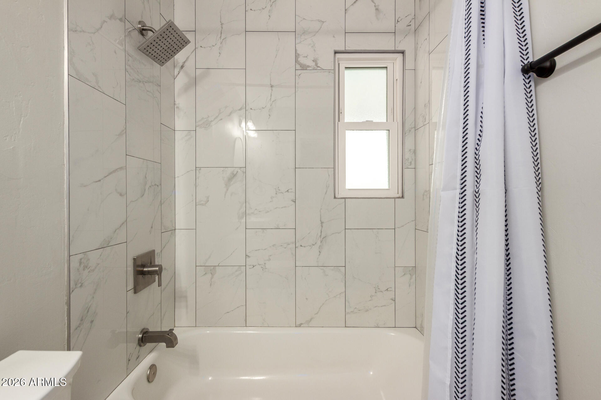 4010 North 11th Avenue Phoenix, AZ 85013 - Photo 18 of 22 a bathroom with a bathtub and shower