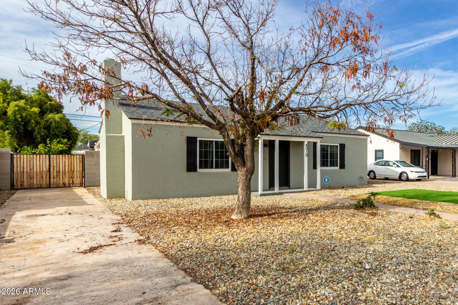 4010 North 11th Avenue Phoenix, AZ 85013 - Photo 3 of 22 a front view of a house with a yard