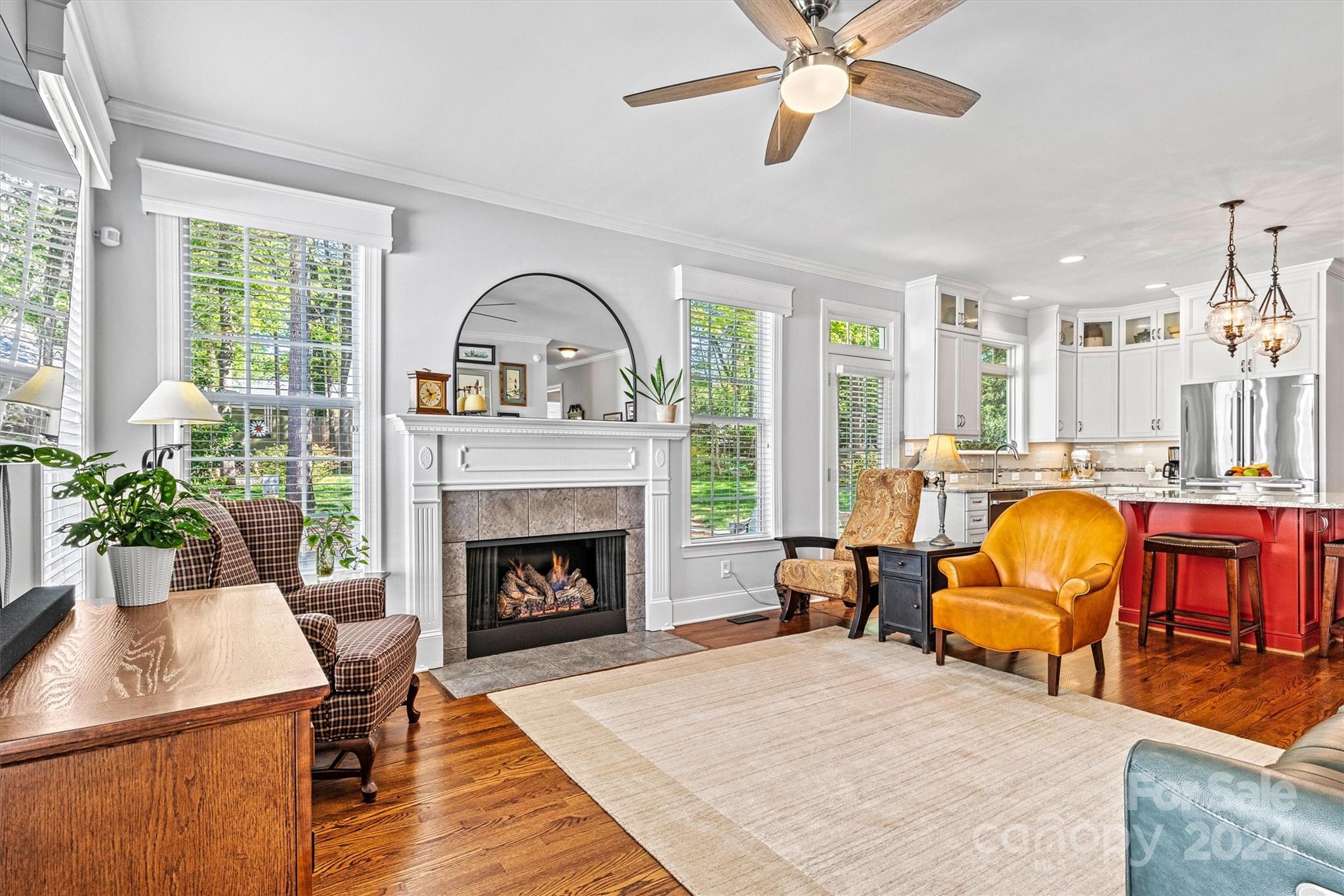 21329 Summerbrook Drive Cornelius, NC 28031 - Photo 14 of 46 a living room with furniture and a fireplace