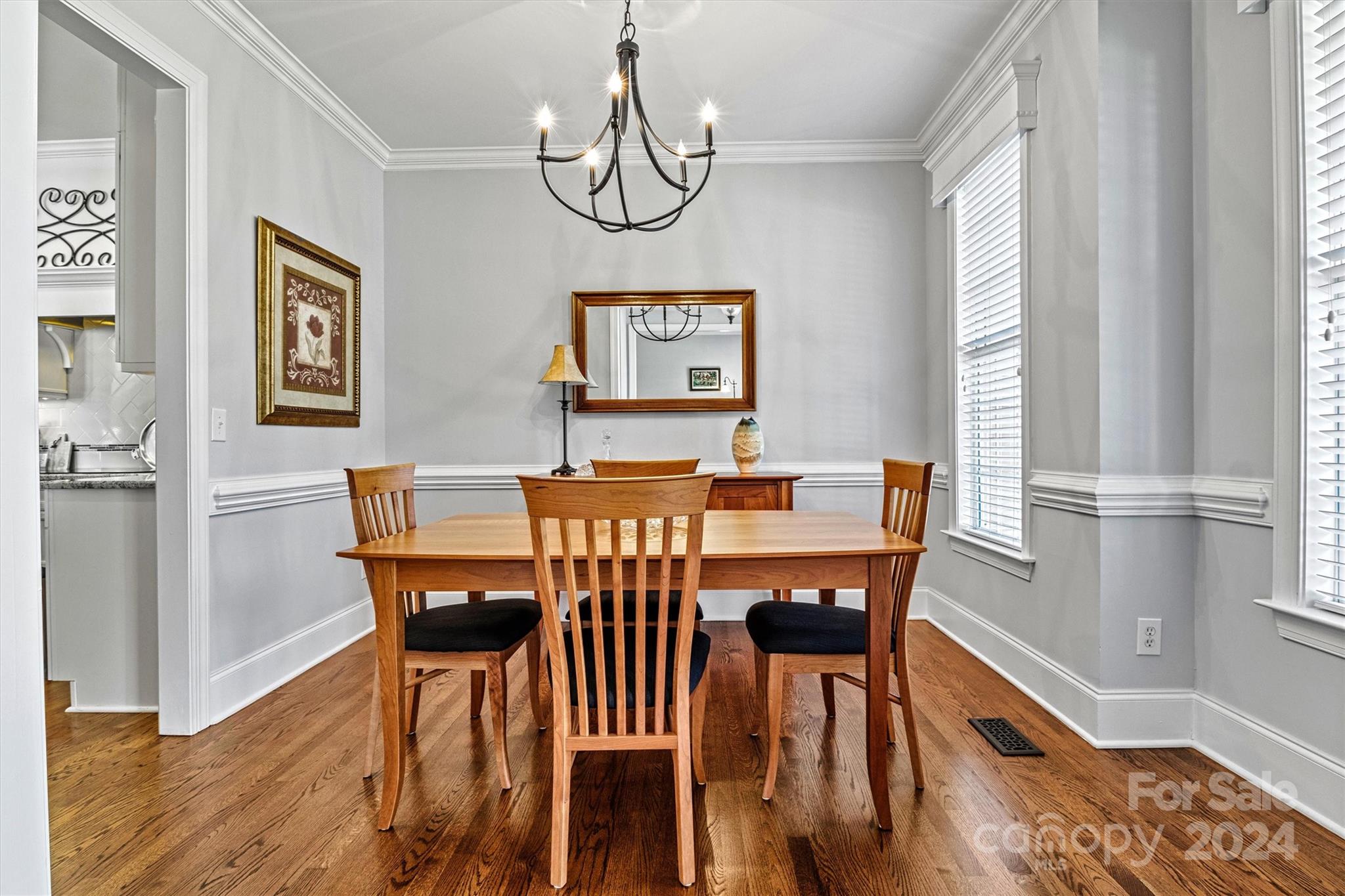 21329 Summerbrook Drive Cornelius, NC 28031 - Photo 16 of 46 a view of a dining room with furniture window and wooden floor
