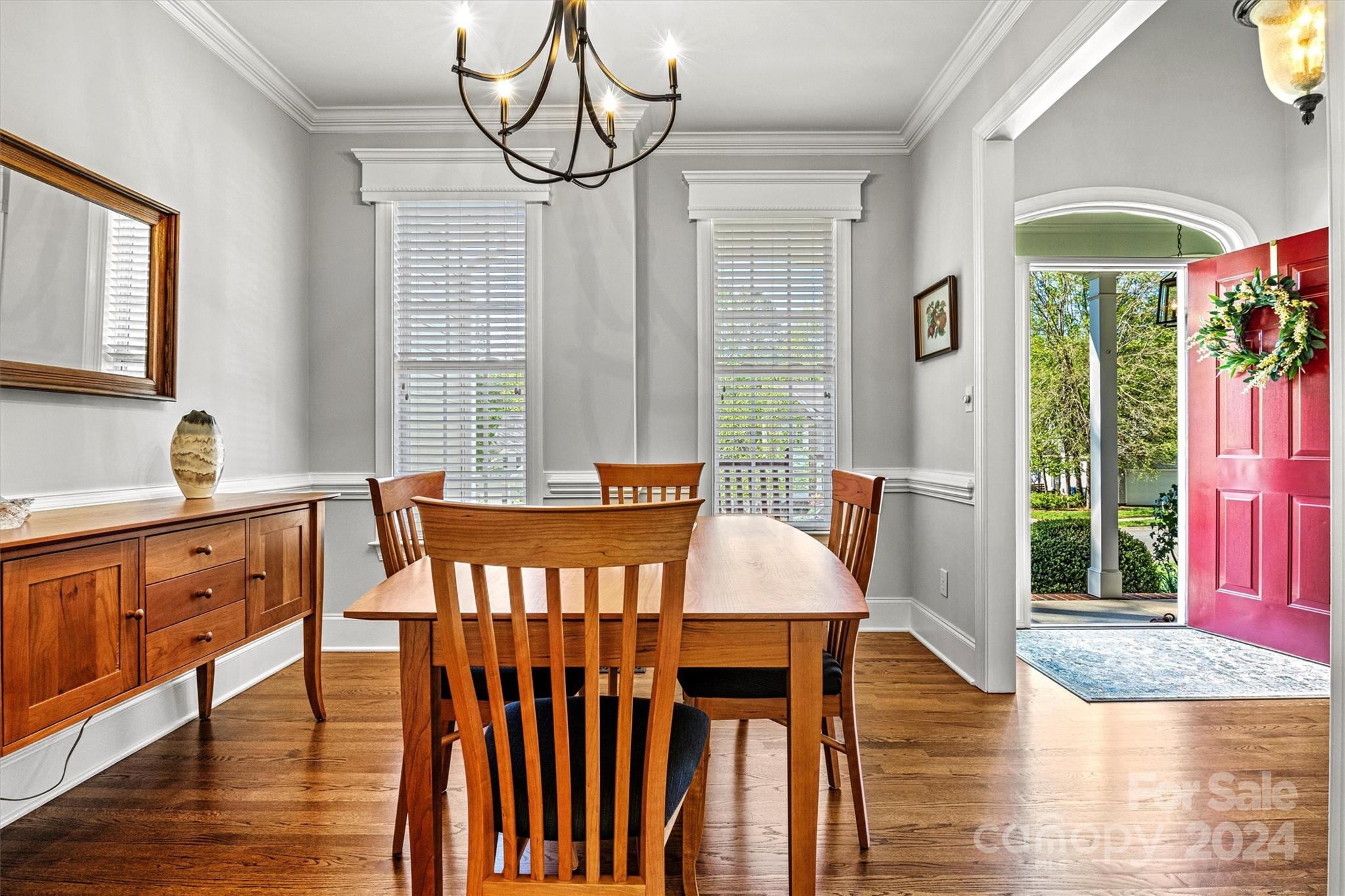 21329 Summerbrook Drive Cornelius, NC 28031 - Photo 18 of 46 a view of a dining room with furniture window and wooden floor
