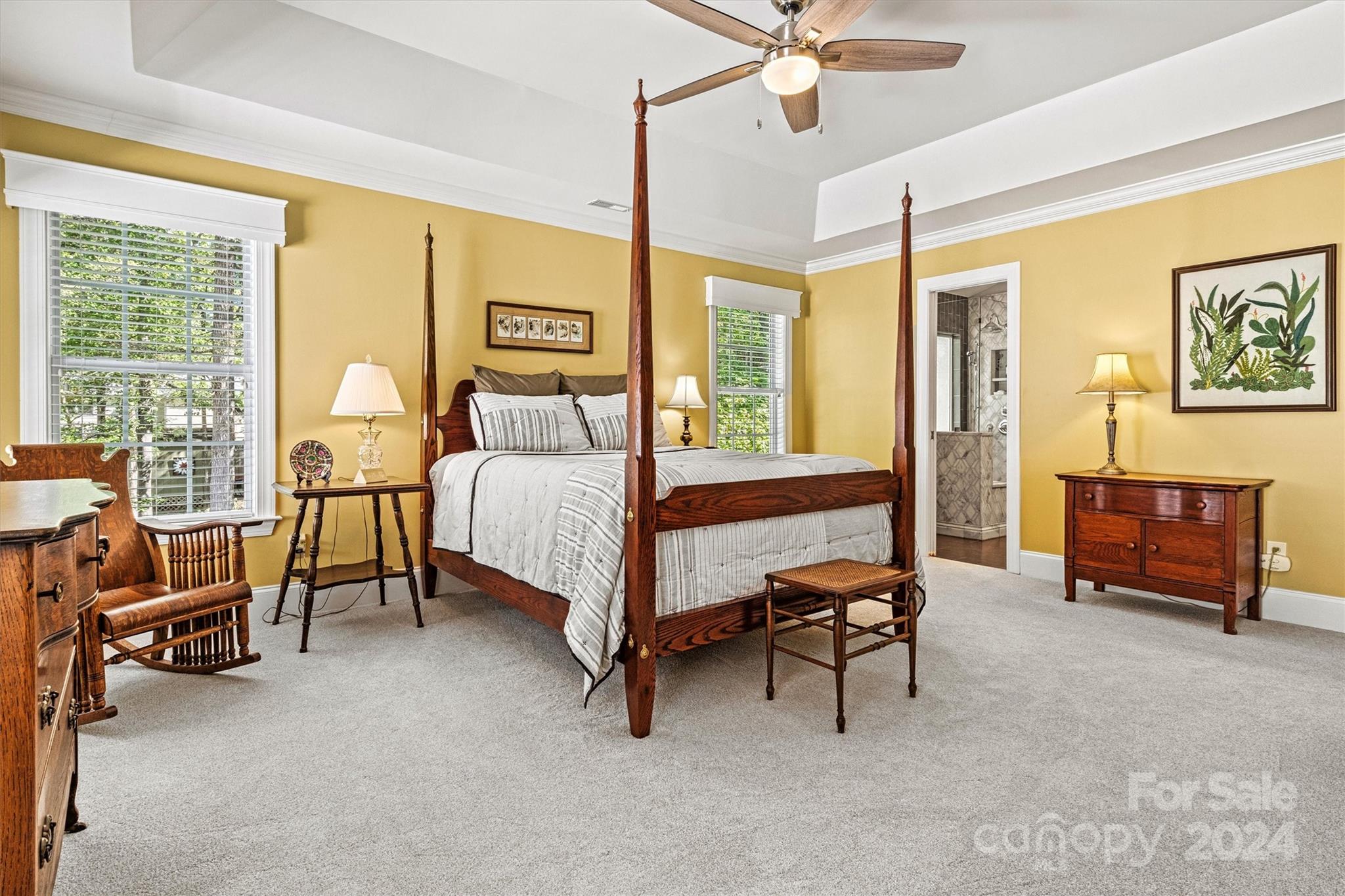 21329 Summerbrook Drive Cornelius, NC 28031 - Photo 22 of 46 a bedroom with a bed and a chandelier