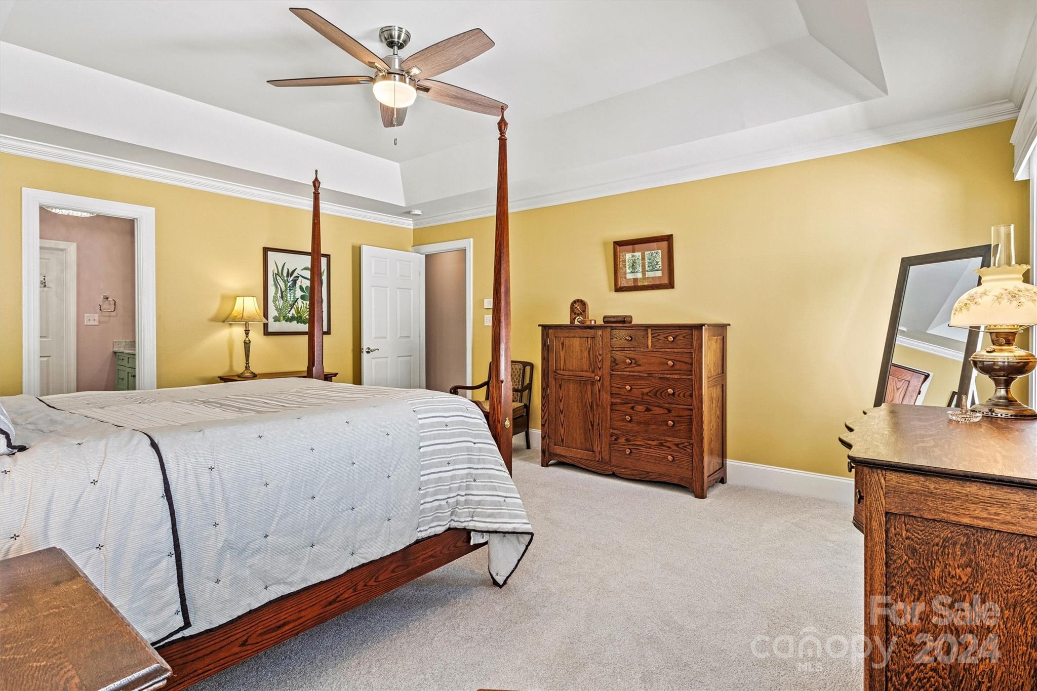 21329 Summerbrook Drive Cornelius, NC 28031 - Photo 24 of 46 a spacious bedroom with a bed and a dresser