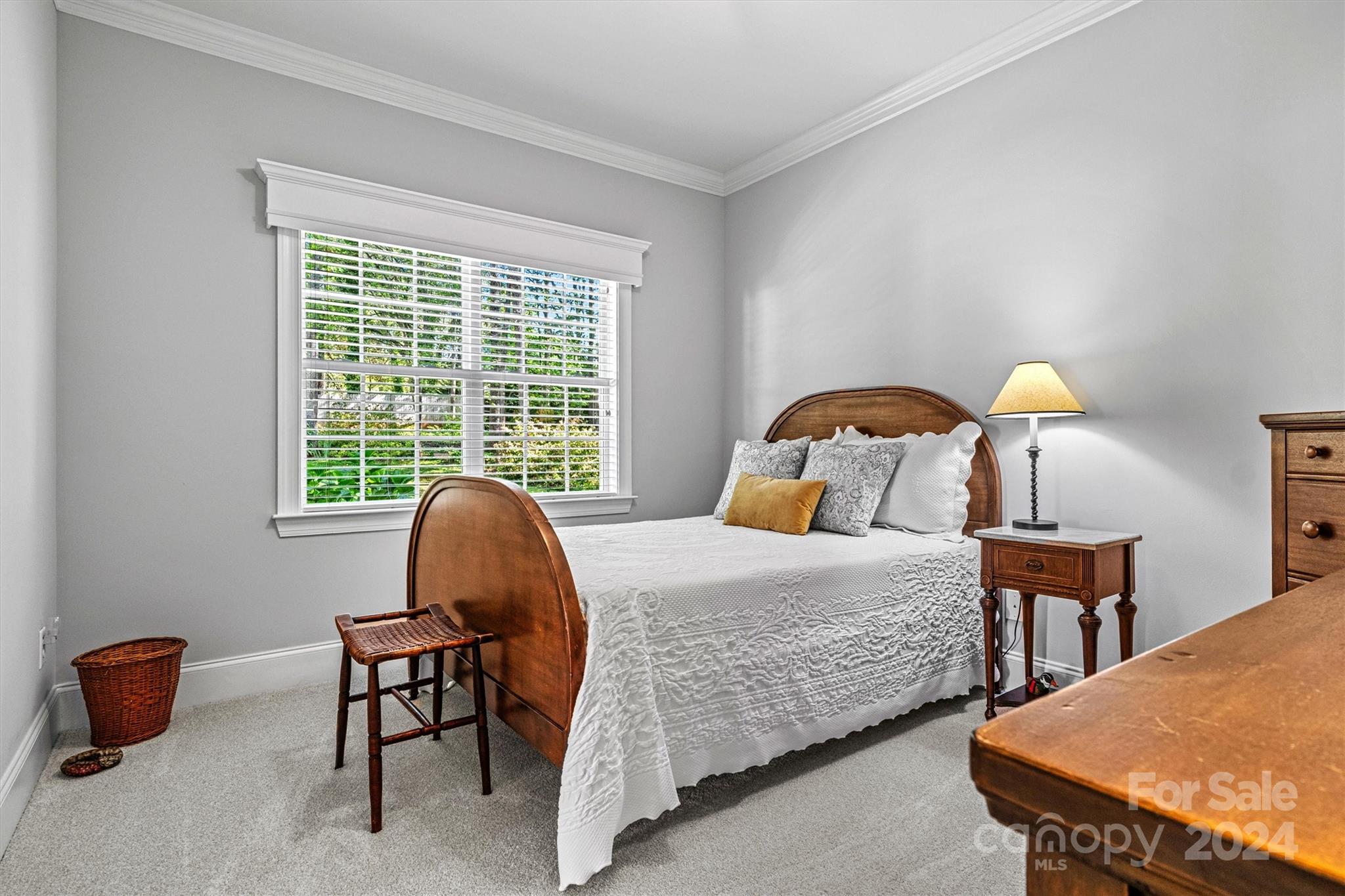 21329 Summerbrook Drive Cornelius, NC 28031 - Photo 29 of 46 a bedroom with a bed a couch and a window