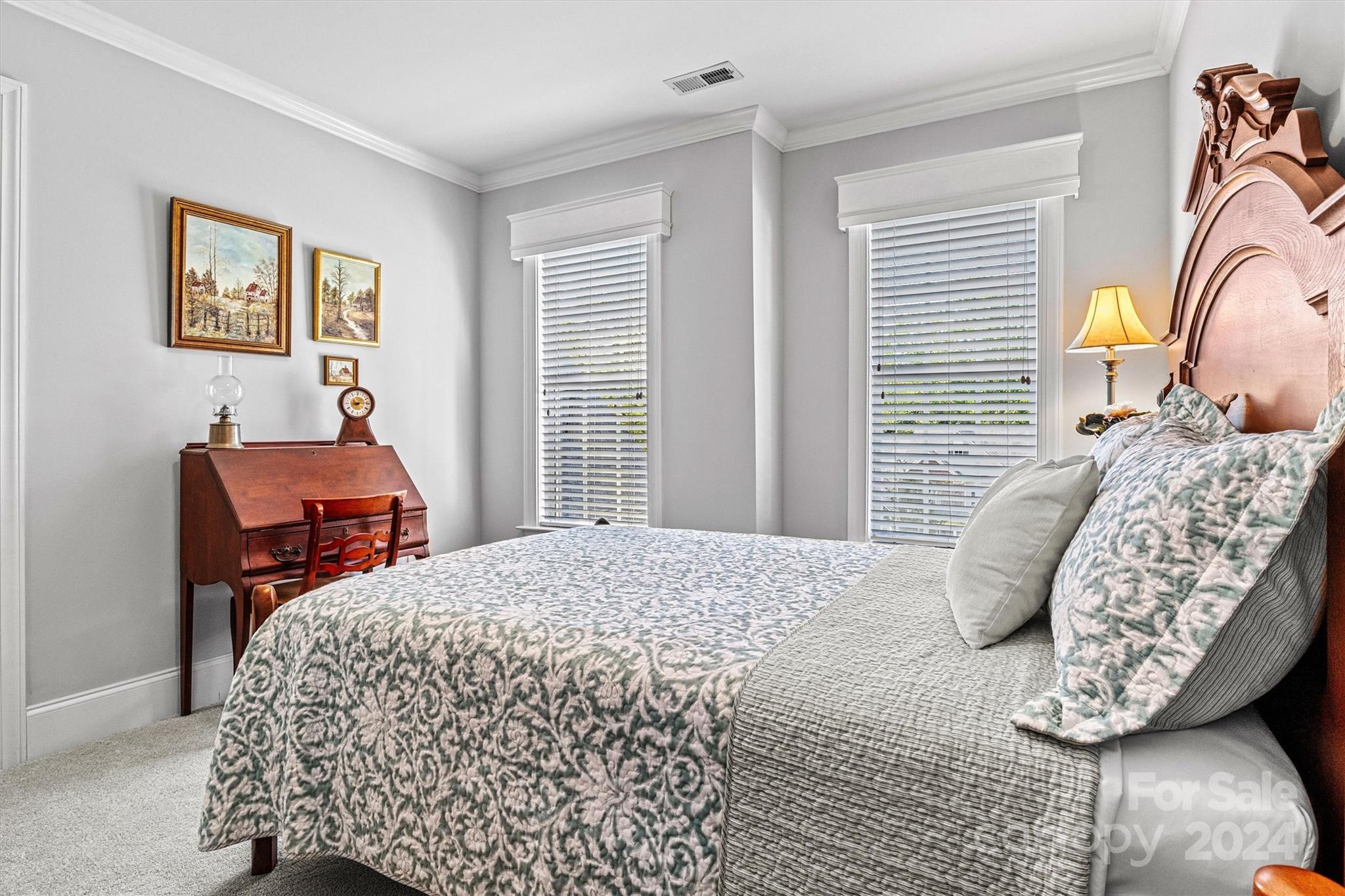 21329 Summerbrook Drive Cornelius, NC 28031 - Photo 33 of 46 a bedroom with a bed and dresser with mirror