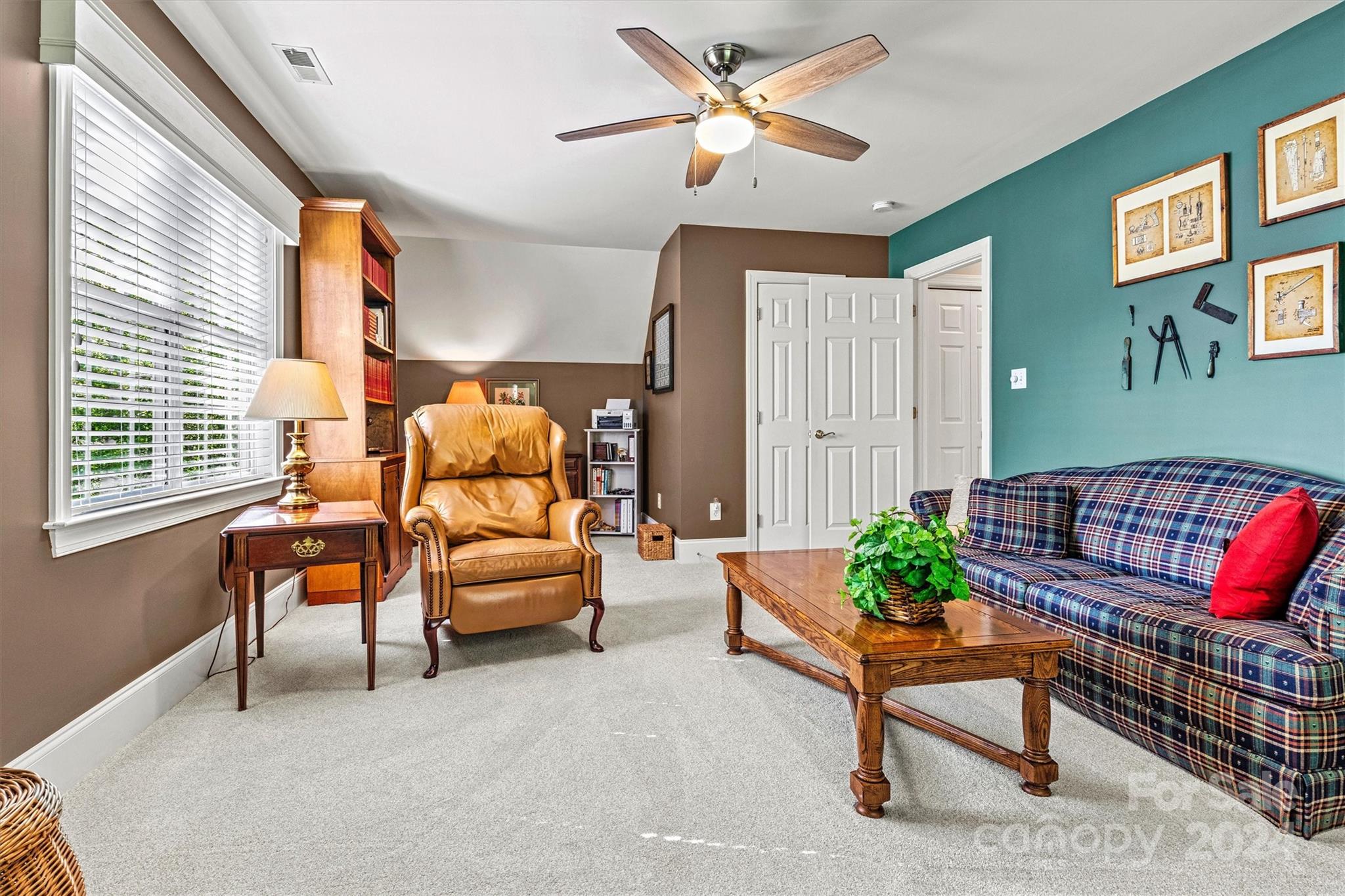 21329 Summerbrook Drive Cornelius, NC 28031 - Photo 38 of 46 a living room with furniture and a large window
