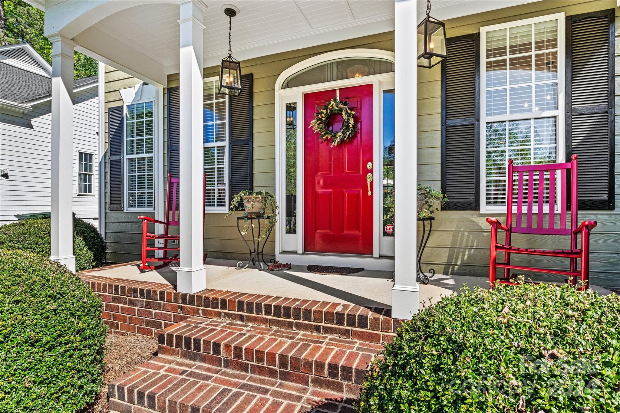 21329 Summerbrook Drive Cornelius, NC 28031 - Photo 4 of 46 a front view of a building with glass door