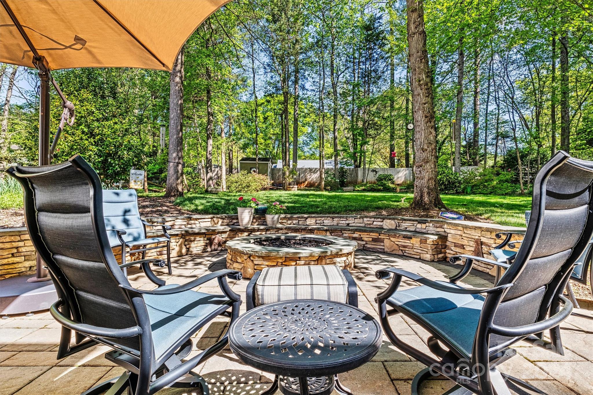 21329 Summerbrook Drive Cornelius, NC 28031 - Photo 44 of 46 a view of a chairs and table in backyard