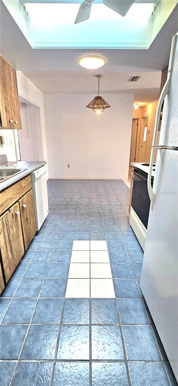 8449 Southwest 106th Place Ocala, FL 34481 - Photo 12 of 37 a view of a kitchen with a sink and a stove top oven