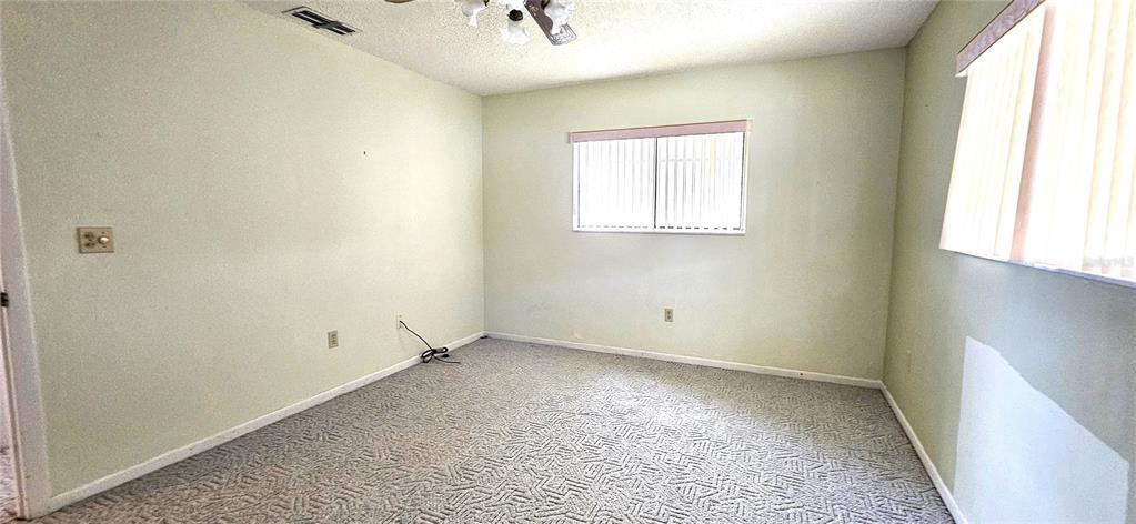 8449 Southwest 106th Place Ocala, FL 34481 - Photo 14 of 37 an empty room with windows