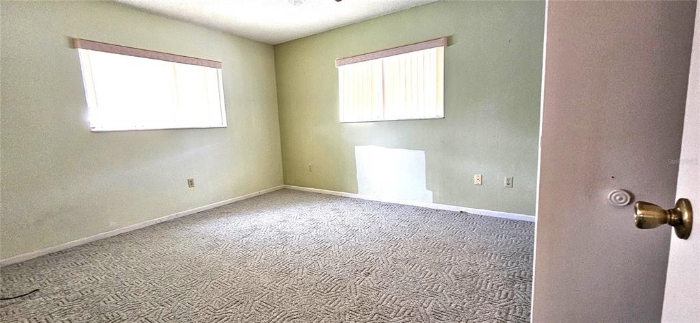 8449 Southwest 106th Place Ocala, FL 34481 - Photo 15 of 37 an empty room with windows