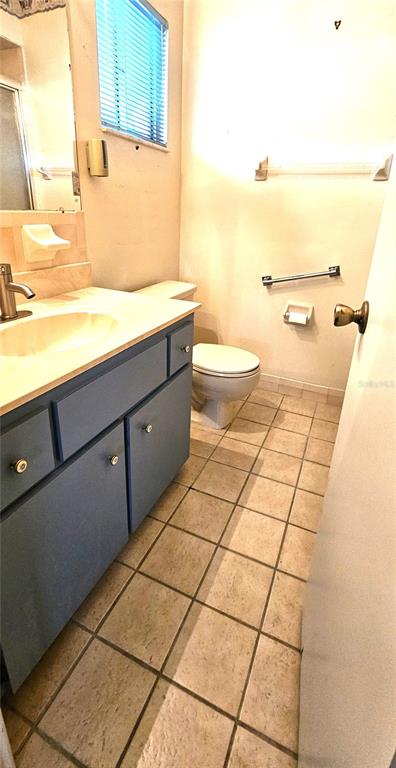 8449 Southwest 106th Place Ocala, FL 34481 - Photo 16 of 37 a bathroom with a sink and a toilet