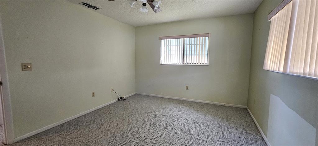 8449 Southwest 106th Place Ocala, FL 34481 - Photo 18 of 26 an empty room with a window