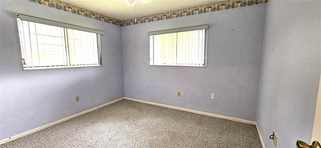 8449 Southwest 106th Place Ocala, FL 34481 - Photo 18 of 37 an empty room with windows