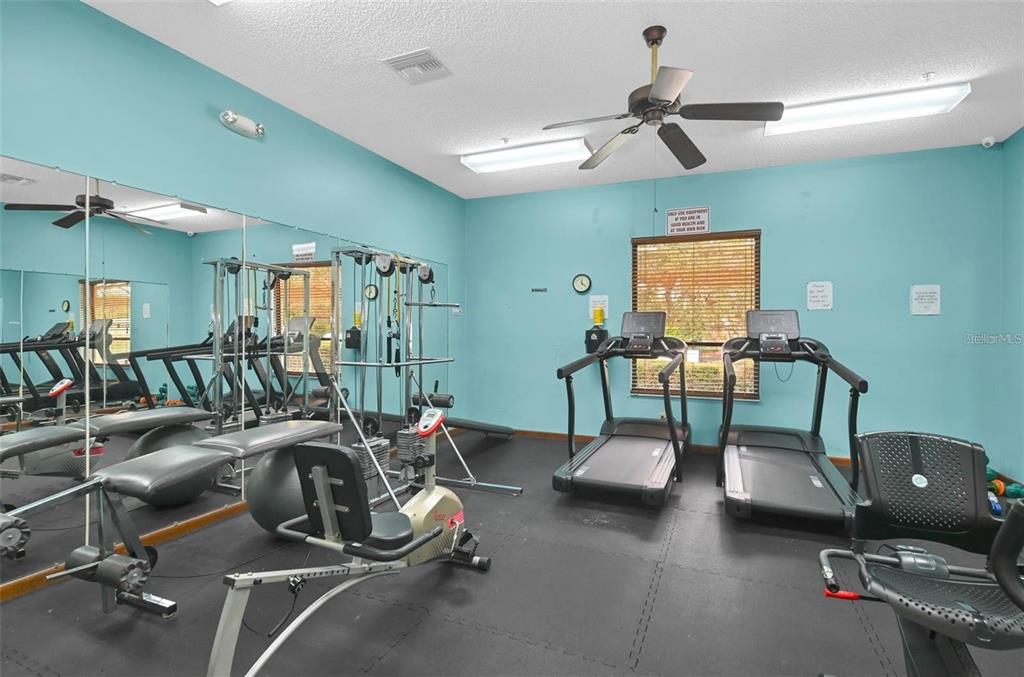 8449 Southwest 106th Place Ocala, FL 34481 - Photo 26 of 37 a view of a room with gym equipment