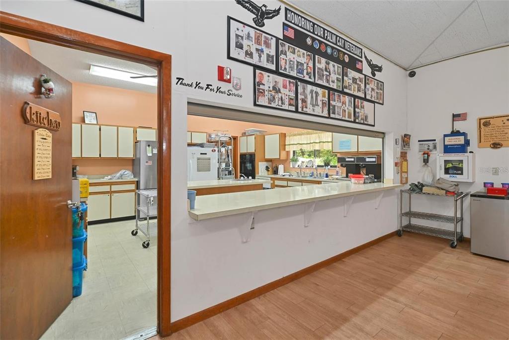 8449 Southwest 106th Place Ocala, FL 34481 - Photo 29 of 37 a kitchen with stainless steel appliances refrigerator and cabinets