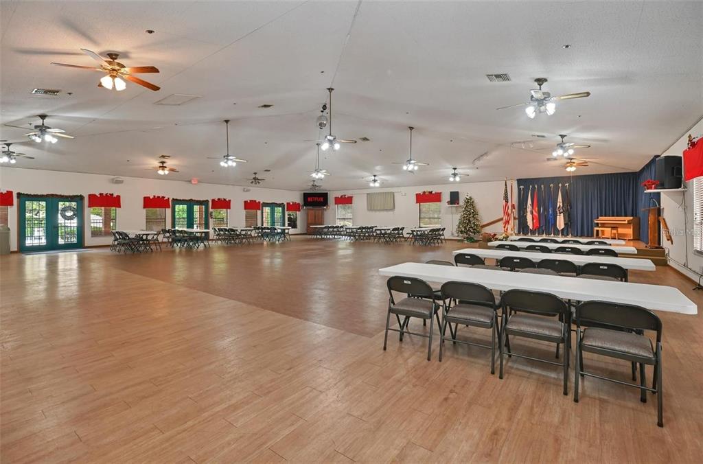 8449 Southwest 106th Place Ocala, FL 34481 - Photo 31 of 37 a view of a room with gym equipment and kitchen view