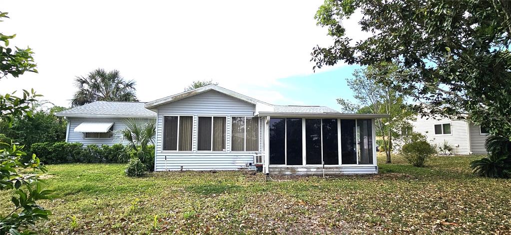 8449 Southwest 106th Place Ocala, FL 34481 - Photo 5 of 37 a view of a house with a garden