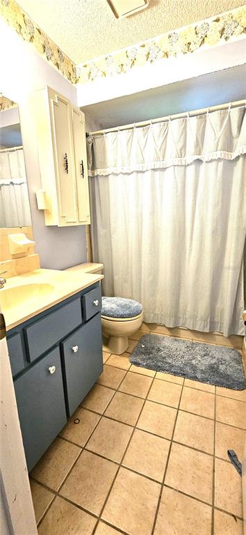8449 Southwest 106th Place Ocala, FL 34481 - Photo 7 of 37 a view of a bathroom with a sink a window and a toilet