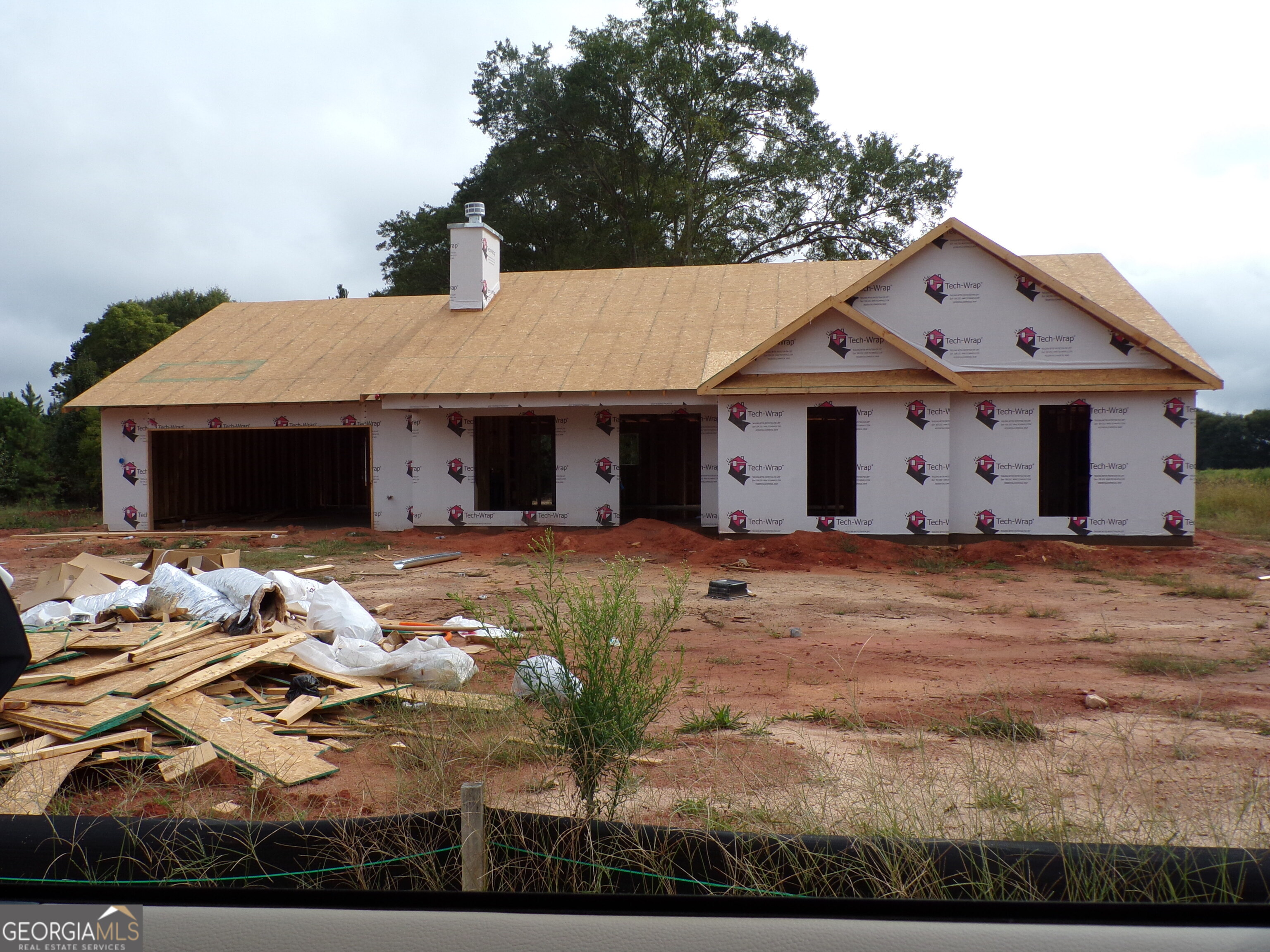 198 Mockingbird Lane, Unit 30 Winder, GA 30680 - Photo 1 of 39 a front view of a house with garden