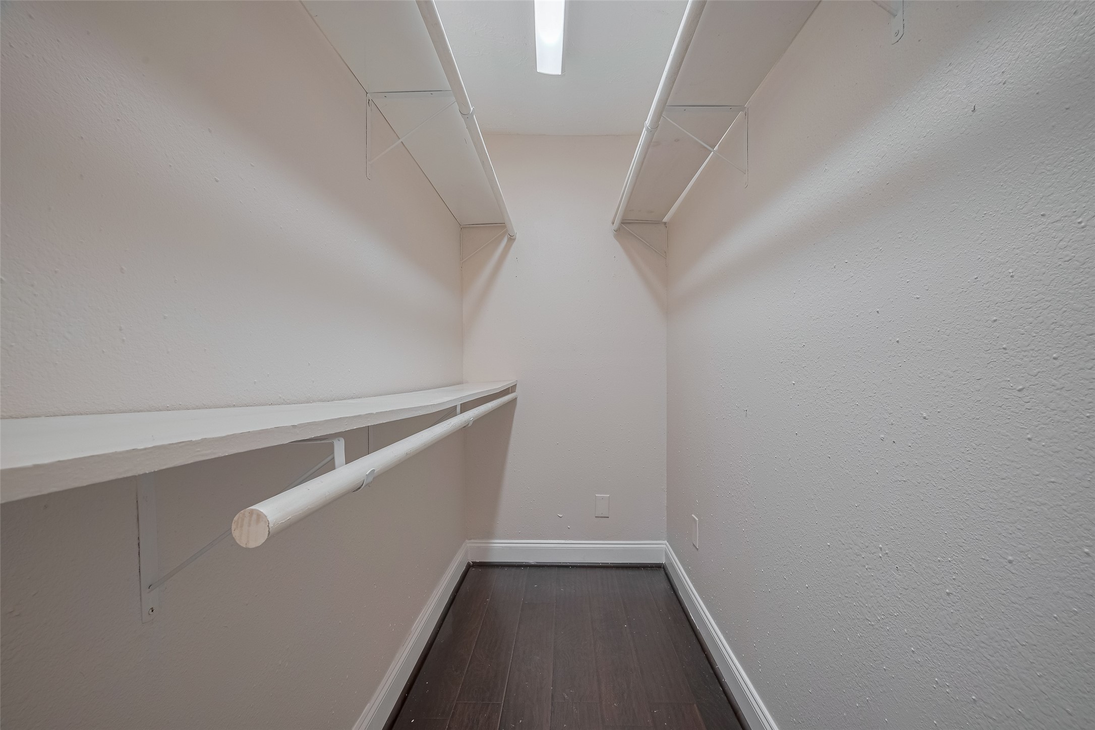 3930 Daphne Street Houston, TX 77021 - Photo 38 of 44 Thoughtfully outfitted, this full-entry closet offers both hanging space and built-in shelving—ideal for keeping things organized and easy to access.