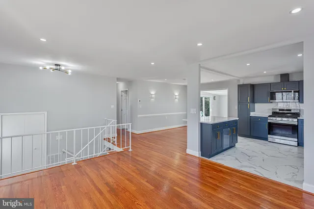 a view of kitchen with sink and microwave