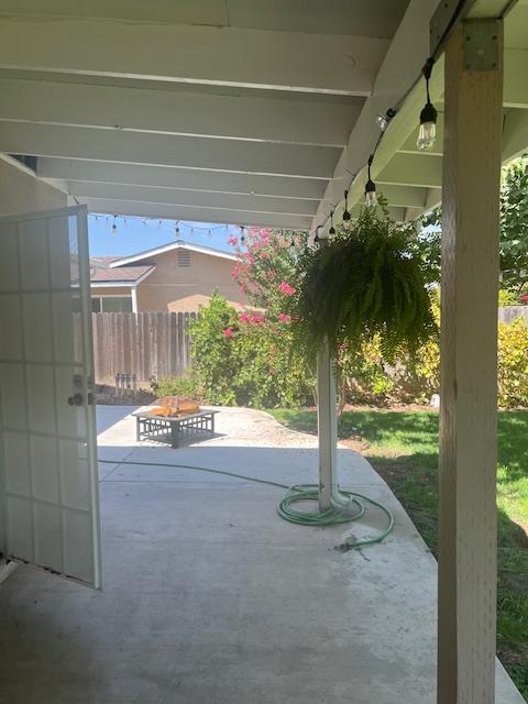 933 Russell Avenue Clovis, CA 93612 - Photo 9 of 10 a view of a porch with a table and chairs