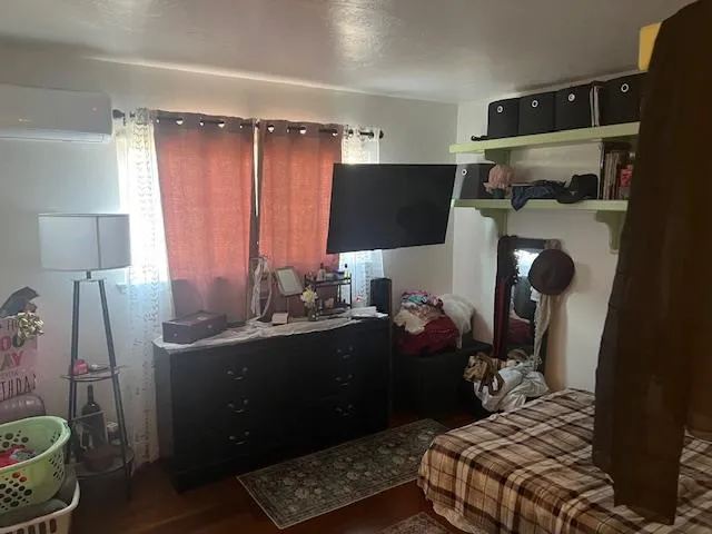 a room with a chair and gym equipment