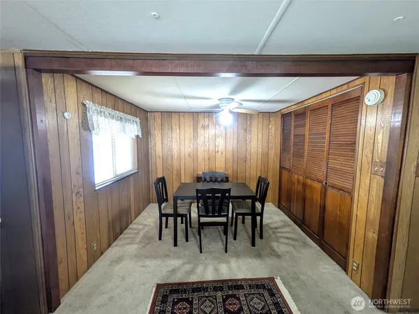 a view of a livingroom with furniture and a window