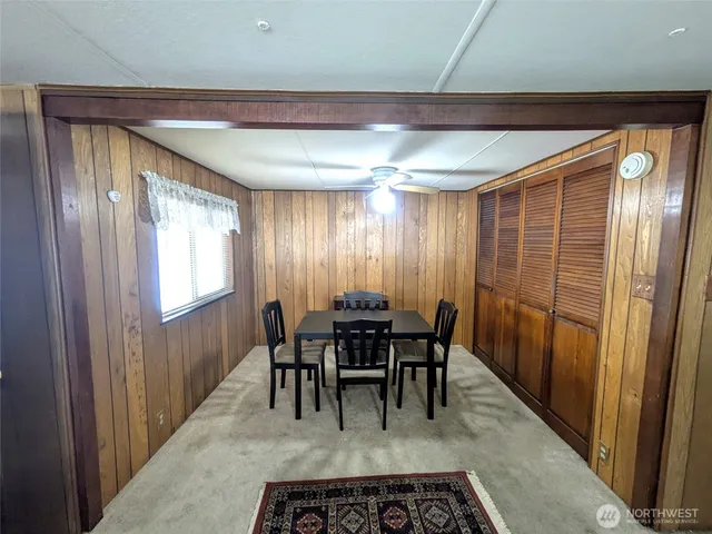 a view of a livingroom with furniture and a window
