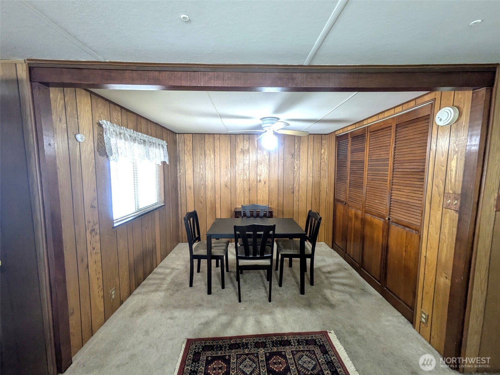 2302 R Street Southeast, Unit 108 Auburn, WA 98002 - Photo 11 of 23 a view of a dining room with furniture window and outside view