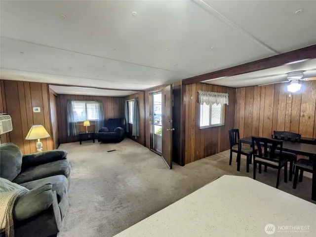 a living room with furniture and a lamp