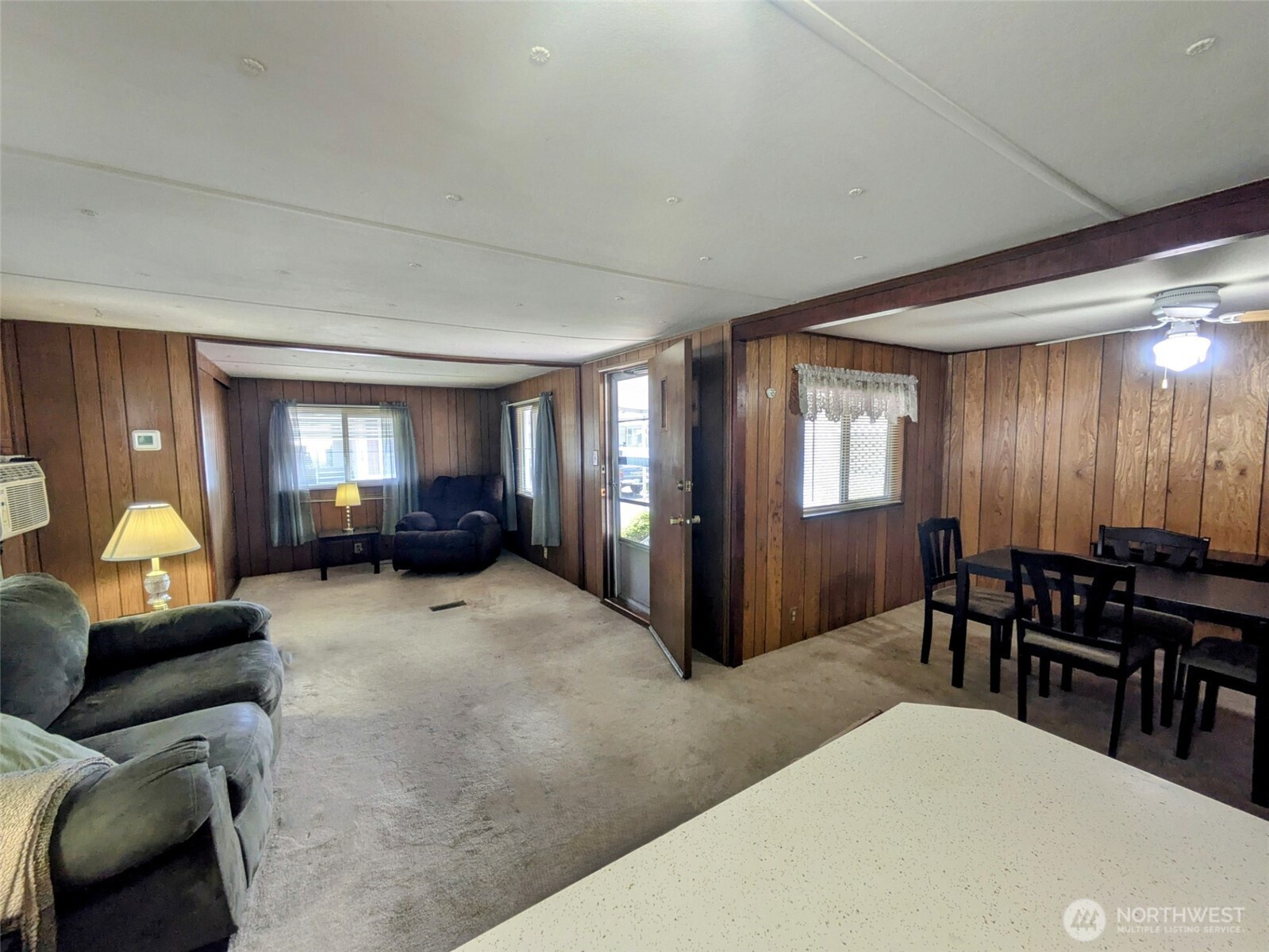 2302 R Street Southeast, Unit 108 Auburn, WA 98002 - Photo 12 of 23 a view of a livingroom with furniture and a window